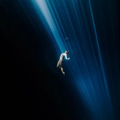 I am a freediver, which allows me to create visuals that most can't. This was captured in a cenote in Mexico, playing with the natural light beams that cut through the darkness. It’s about finding art in the elements.