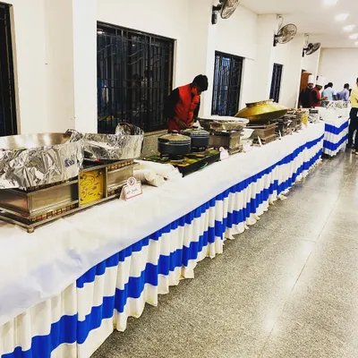 A clean and simple buffet setup for an indoor event. Even for more modest arrangements, I ensure the food is delicious and the service is professional.