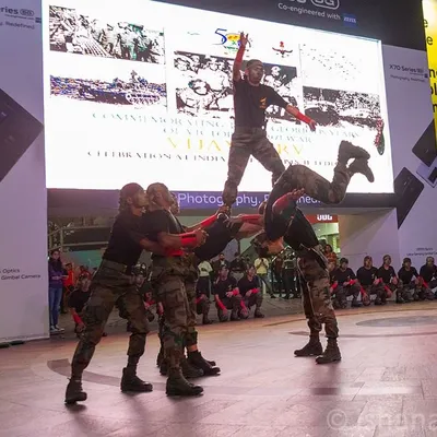 An action shot of the Indian Army's acrobatic team performing at the 'Vijay Parv' celebration in Cyberhub, Gurugram. My event photography aims to capture the most dynamic and visually compelling moments.
