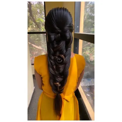 An advanced braiding technique taught in my course, featuring a 3D rose sculpted from hair within the braid. This style requires precision and is a true work of art.