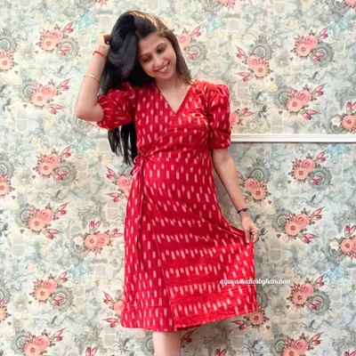 The Angrakha wrap dress in a striking red Ikat. This design is timeless, with puff sleeves and a tie-waist that gives it a beautiful, flattering shape.