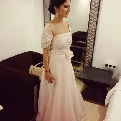 This light pink off-shoulder gown is one of my absolute favorites. It’s perfect for an engagement or cocktail party, with a flowing silhouette that feels both elegant and comfortable.