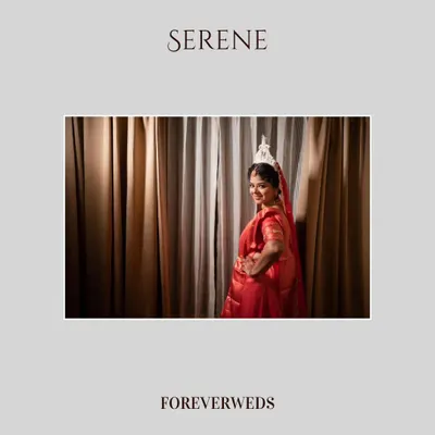 Serene and graceful. This portrait of Bhawana, a beautiful Bengali bride, was taken in a quiet moment before her ceremony. The soft lighting and simple background highlight her traditional attire and calm demeanor.