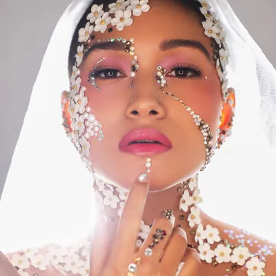 This is what it means to think outside the box. We teach you how to use unconventional materials like these flowers and crystals to create true makeup art.