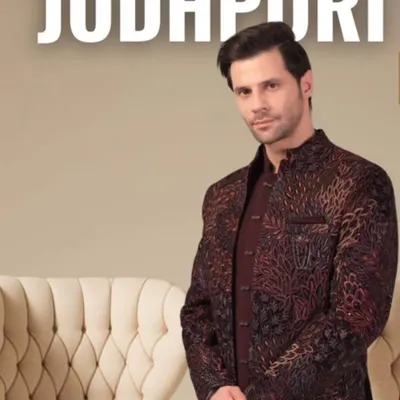 Our Jodhpuri suits are a perfect blend of tradition and modern style. This piece features a unique printed fabric with a rich texture, tailored for a sharp, regal silhouette. It's an ideal choice for sangeet, engagements, or any festive occasion.