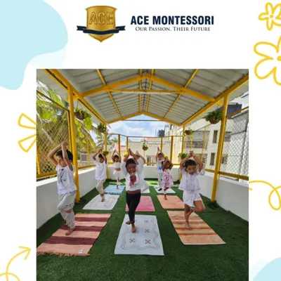 Children practice the tree pose during our rooftop yoga session. Yoga helps them develop balance, flexibility, and a sense of inner calm.