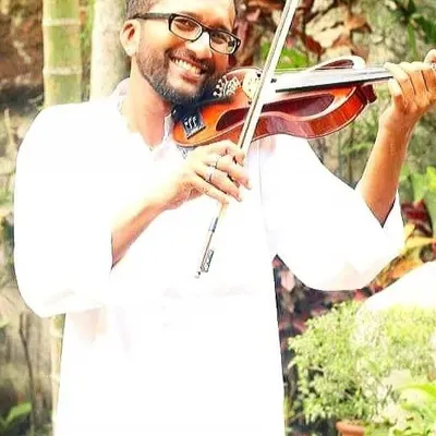 We also offer instruction in Carnatic music. Here is violinist K. Logeswaran, a "Best Rhythmite Maestro" from Malaysia, who specializes in Carnatic violin and vocals.