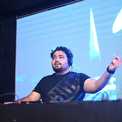 A clear shot of me in action behind the decks. This is where I feel most alive, connecting with the crowd through music.