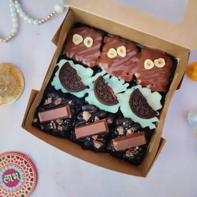 My assorted brownie box is always a hit. This box includes three of my most-loved flavors: rich Nutella Hazelnut, creamy White Chocolate-Oreo, and crunchy KitKat brownies, all freshly baked and ready to be gifted.