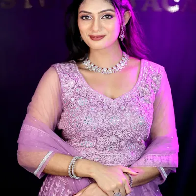 A stunning party look in a lavender lehenga. The makeup is glamorous with defined eyes and a beautiful lip color, perfect for an evening reception or sangeet.