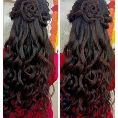 Advanced hairstyling is a key part of our cosmetology course. Here, a student has crafted an elegant half-updo with a detailed rose bun and long, flowing soft curls, a popular choice for receptions and parties.