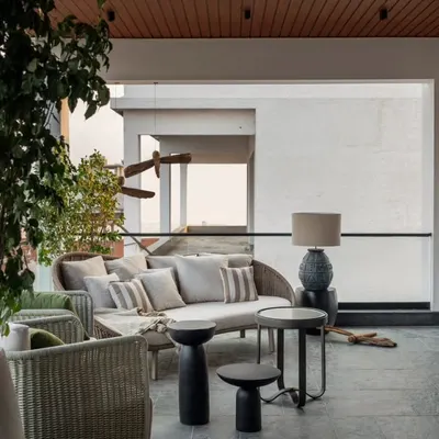 The deck area of the Aikaa show villa, which spills out from the home theatre. It's a perfect example of creating a fluid connection between indoor entertainment and outdoor relaxation.