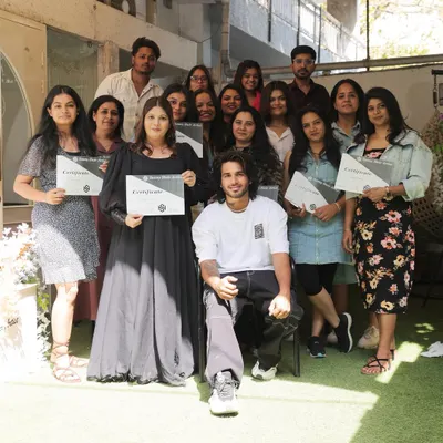 A proud moment with my students at the end of a successful masterclass. Each artist here has put in the work to master advanced hairstyling techniques.