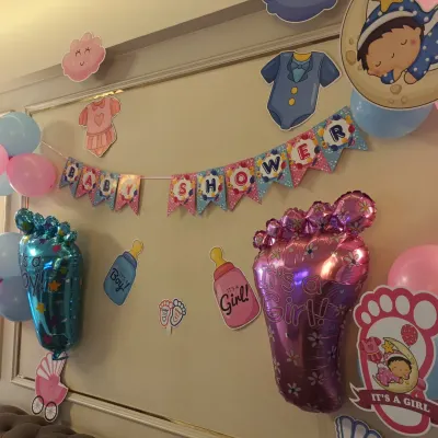 A charming baby shower decoration we did for a client in Belapur. The setup includes a "Baby Shower" banner, themed cutouts, and foil balloons for "It's a Boy!" and "It's a Girl!".