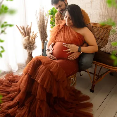 A tender moment between a couple in my favorite boho setup. The natural textures and warm light create such a cozy and intimate atmosphere for a maternity photoshoot.