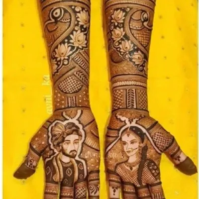 A close-up of my portrait work. I focus on capturing the unique features and expressions of the bride and groom, ensuring the portraits are a true likeness. This design is set against a backdrop of lotus and peacock patterns.