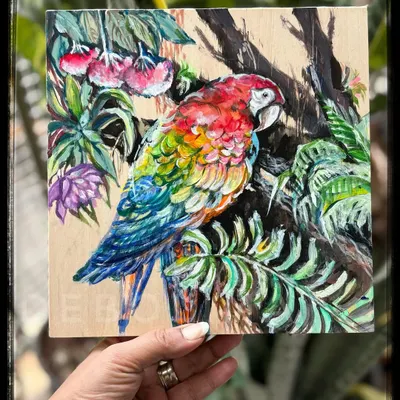 A vibrant macaw painted with acrylics on a wood panel. I love the rich, opaque colors of acrylics, which create a beautiful contrast with the natural wood grain.