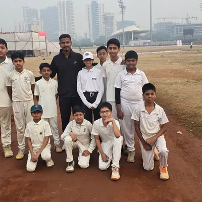 Our young cricketers with their coach, a snapshot of the bond we share as a team.
