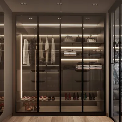 A closet designed for her. This section of the bespoke His & Hers walk-in closet features dedicated display space for handbags, adjustable shoe shelves, and ample hanging room, all illuminated by integrated LED lighting.