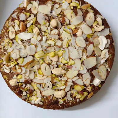 My Whole Wheat Jaggery Cake is a bestseller for a reason. It's a dense, moist cake made with atta and gud, and absolutely covered in a mix of healthy nuts and dry fruits.