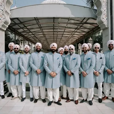 A powerful vision of brotherhood, with the groom and his party in perfectly coordinated light blue sherwanis. We ensure every member of your crew complements your look while maintaining their individual fit.