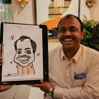 A happy employee at a corporate get-together at one8 commune. Live sketching is a fantastic way to add a personal and fun touch to company events.