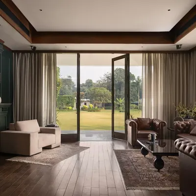 This view from the den at Mehalin Farm is a primary example of my indoor-outdoor living concept. The open doors and minimal threshold remove the barrier between the comfortable interior and the expansive lawn.