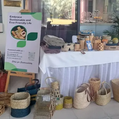 This photo from a recent pop-up event displays a wide array of our sustainable products, from handcrafted baskets and bags to bamboo tableware. We partner with corporations and institutions to help them achieve their sustainability goals through our eco-friendly solutions.