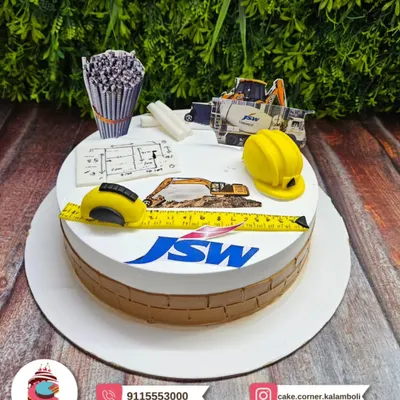 A detailed construction-themed cake for a JSW employee. Featuring a measuring tape, blueprints, and a hard hat, it's perfect for an engineer or builder.