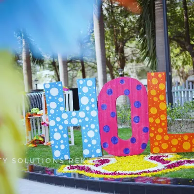 A vibrant and playful HOLI photo installation. I used large, colorful letters and a rangoli made of flower petals to create a fun and festive spot for guests to take pictures.