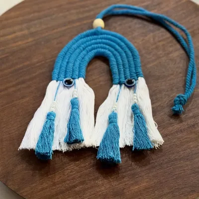 A beautiful blue and white rainbow car charm with evil eye beads for protection. This was a custom order from Faridabad!