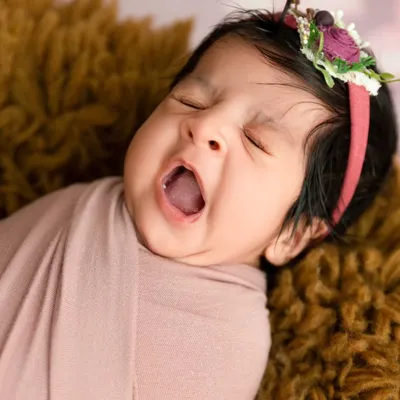 A perfect capture of a newborn's big yawn, showing the candid and authentic moments I look for during a session.