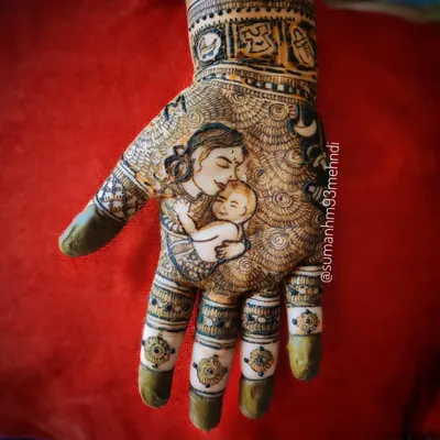 A detailed portrait capturing the tender moment between a mother and her newborn. This style of henna is a beautiful way to honor the journey of motherhood for your baby shower or Godh Bharai.