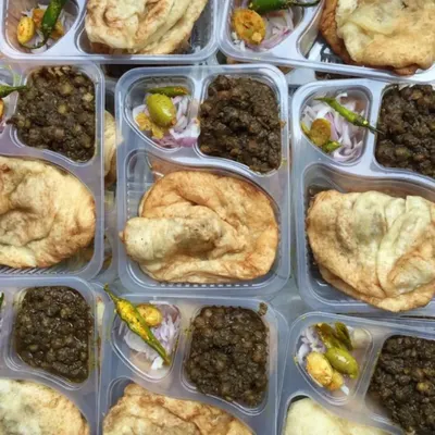 Nothing says comfort like a plate of Chole Bhature. I pack my spicy chickpea curry and fluffy fried bread with a side of pickled onions and green chillies, perfect for delivery so you can enjoy this classic North Indian meal at home.