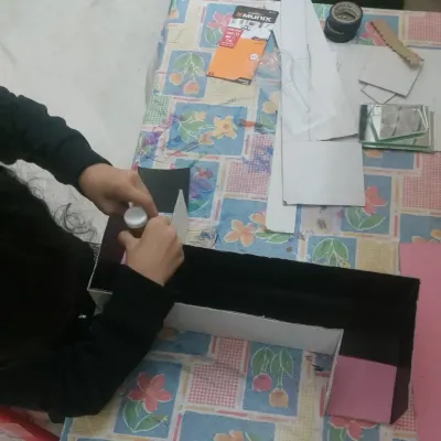 The beginning of a periscope school project. We start by helping the student understand the concept and gather the necessary materials, breaking down a big project into manageable steps.