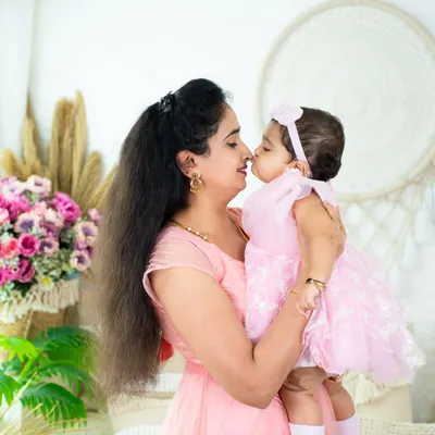 The sweetest Eskimo kiss between a mother and her daughter. These are the tender, unscripted moments that you will cherish for a lifetime.