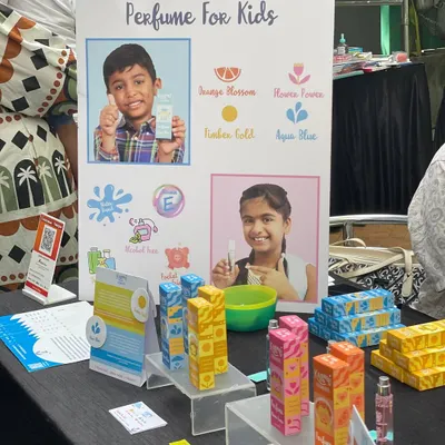 I love finding unique products like this kid-friendly perfume. This vendor's display shows the different scents available, all specially formulated for children.