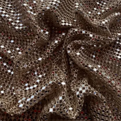 Our most-loved embroidered cutwork fabric is back in three stunning shades. The intricate design with mirror work is perfect for creating glamorous outfits.