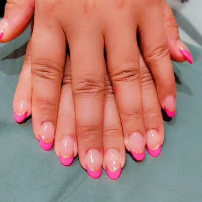 Here is a fun, modern take on the French manicure. I used a bright pink for the tips on these almond nails and added a thin gold glitter line to separate it from the natural base.