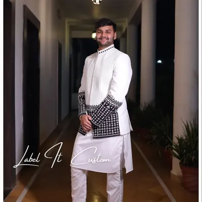 Making the wedding more special, tailored solely for you. Here is my happy client Vijay, looking dapper in a custom white and black Indo-Western set for his special occasion.