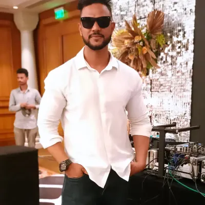 A portrait of me at a gig. I am a professional DJ and music producer from Mumbai, and my mission is to make people dance.
