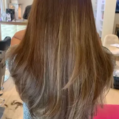 A classic long-layered haircut. This technique adds movement and volume to long hair, removing weight without sacrificing length, and is perfect for a soft, feathered look.