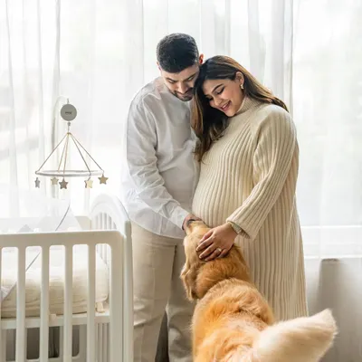 From puppy cuddles to baby snuggles. This maternity shoot with Hugo the Golden Retriever beautifully captures the anticipation of a new arrival. I focus on the tender moments as your pet gets to know the baby bump, creating a touching prelude to their new life as a big brother.
