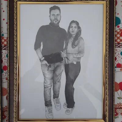 A custom A3-sized pencil sketch I did for a couple. Realistic pencil portraits are a popular choice for personal gifts, capturing a special memory in a timeless piece of art. This one is framed and ready to be displayed.