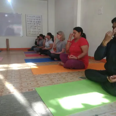 A group of students practicing Anulom Vilom (Alternate Nostril Breathing) at my Aryan Yogshala studio. This pranayama technique is fundamental for calming the mind, balancing energy, and improving respiratory function.