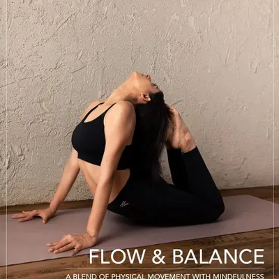 A student gracefully holds a heart-opening backbend in our Flow & Balance class. This Hatha Vinyasa practice is designed to blend physical movement with mindfulness, creating a powerful connection between body and breath.