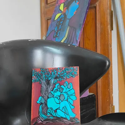The painting "Wanna hear a story from the branches?" displayed in my studio next to another piece. Seeing my works in conversation with each other is always interesting.