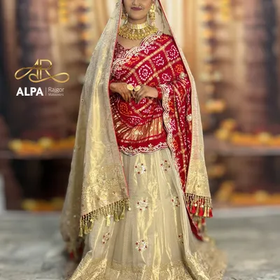 A full-length view of the quintessential Marwadi bride, showcasing the magnificent lehenga and my signature dupatta draping. The makeup is designed to complement the grandeur of the entire ensemble.