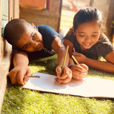 This is what it's all about! Two siblings working together on a page in my Doodle Book.
