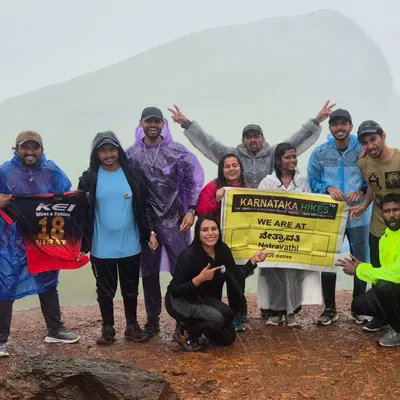 Our trek family at Netravati Peak, proudly showing our RCB and Karnataka spirit. This is the vibe we bring to the mountains!